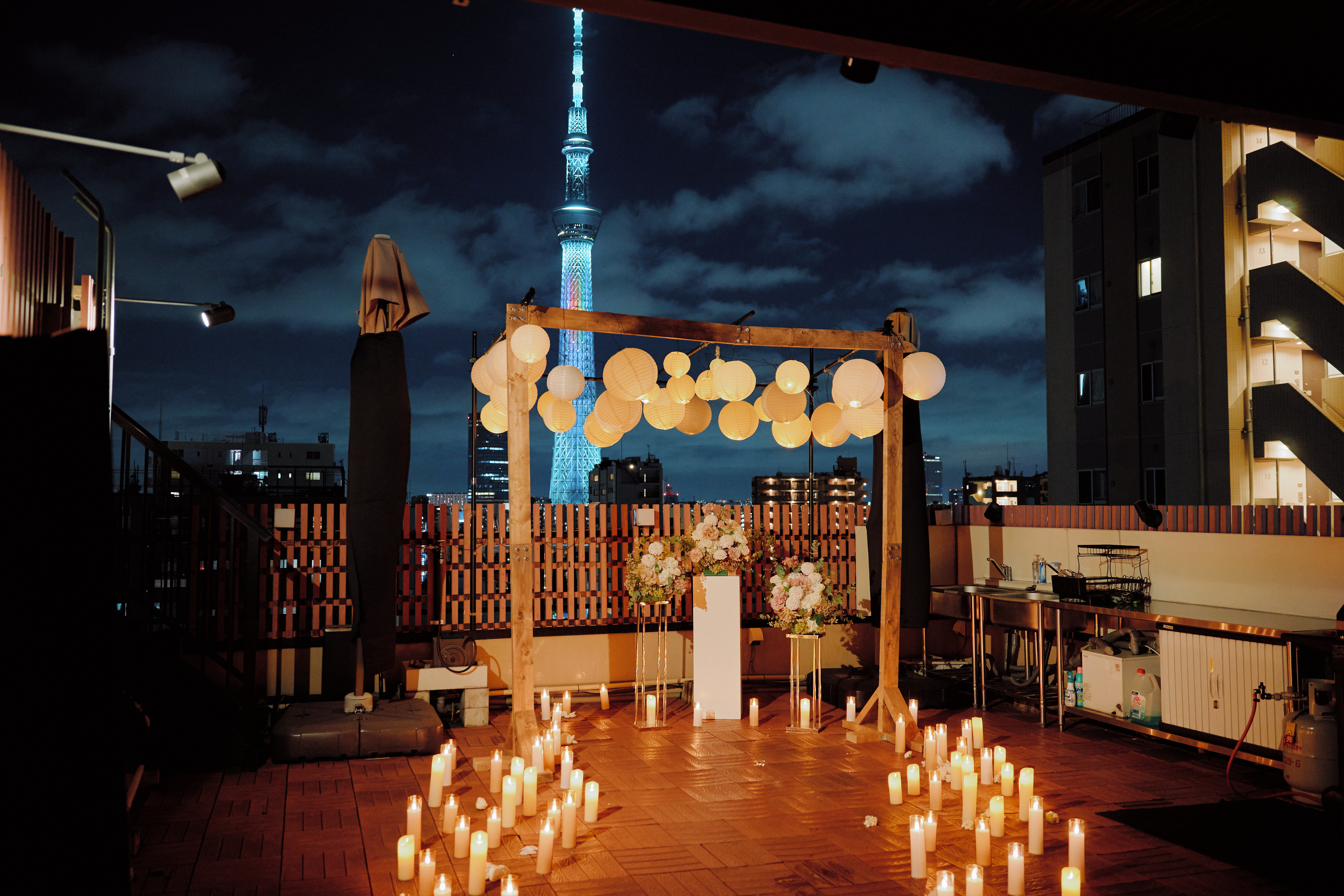 Rooftop proposal setup in Tokyo with Tokyo Skytree in the background