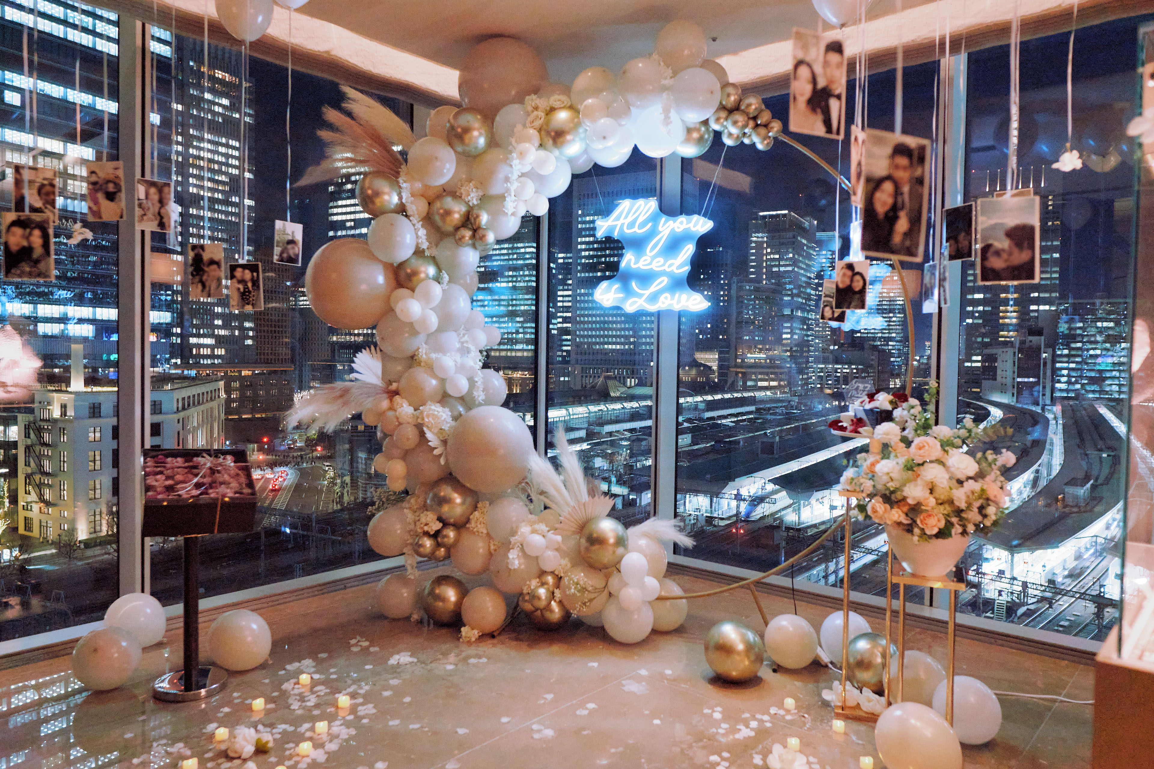 Tokyo proposal setup with city views, floral arrangements and balloon decoration